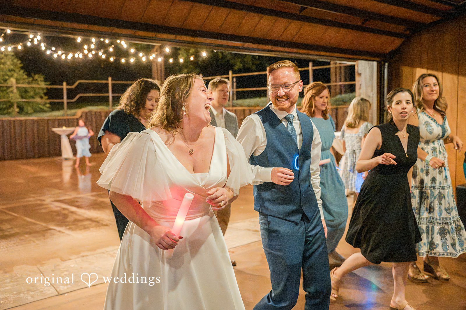 Faith + Brandon Bride dancing and laughing with guests