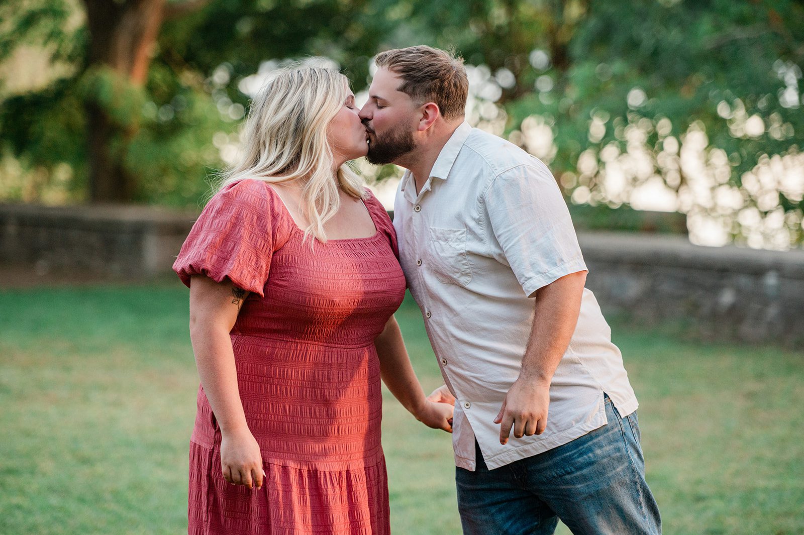 spy-pond-airy-boston-daniel-emily-p014-06 Engaged couple sharing a kiss at Spy Pond