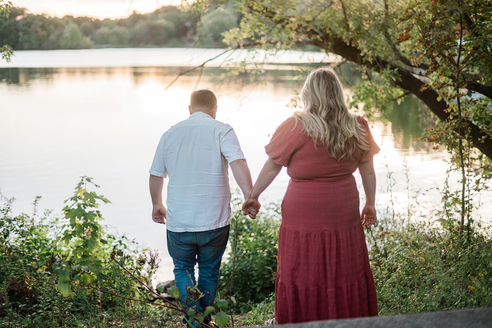 spy-pond-airy-boston-daniel-emily-p017-16 Couple standing by the pond at sunset at Spy Pond