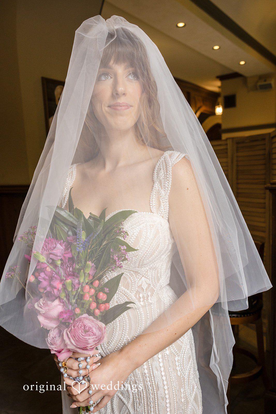 Bride with her veil and bouquet