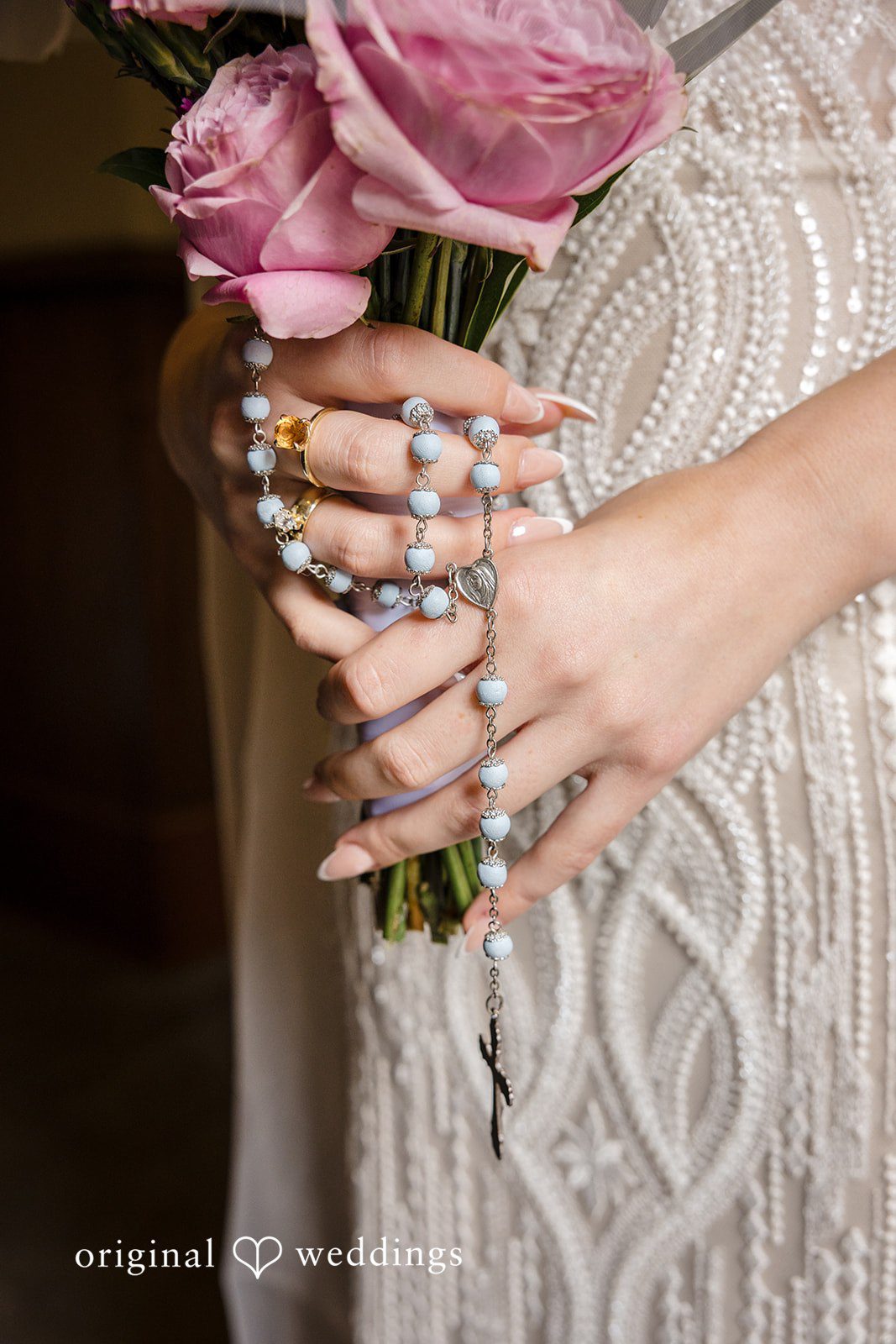 Bride holding pink roses