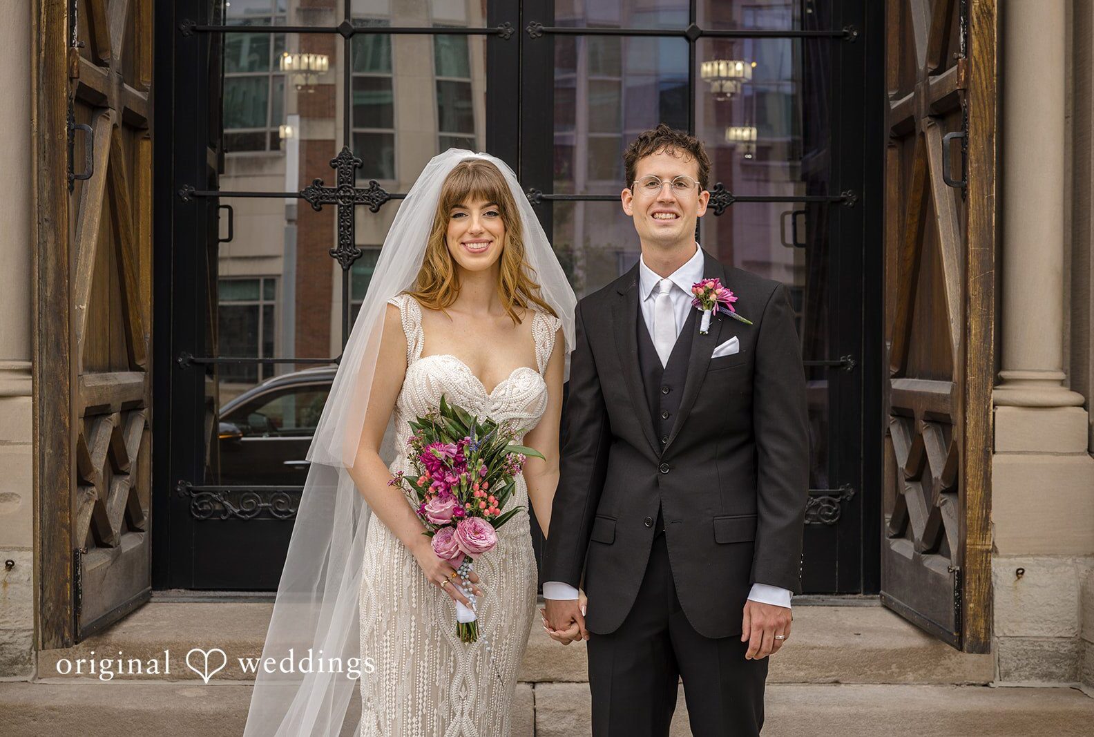 Couple standing in the church doorway, captured by Indianapolis wedding photographers from Original Weddings at St John the Evangelist Catholic Church