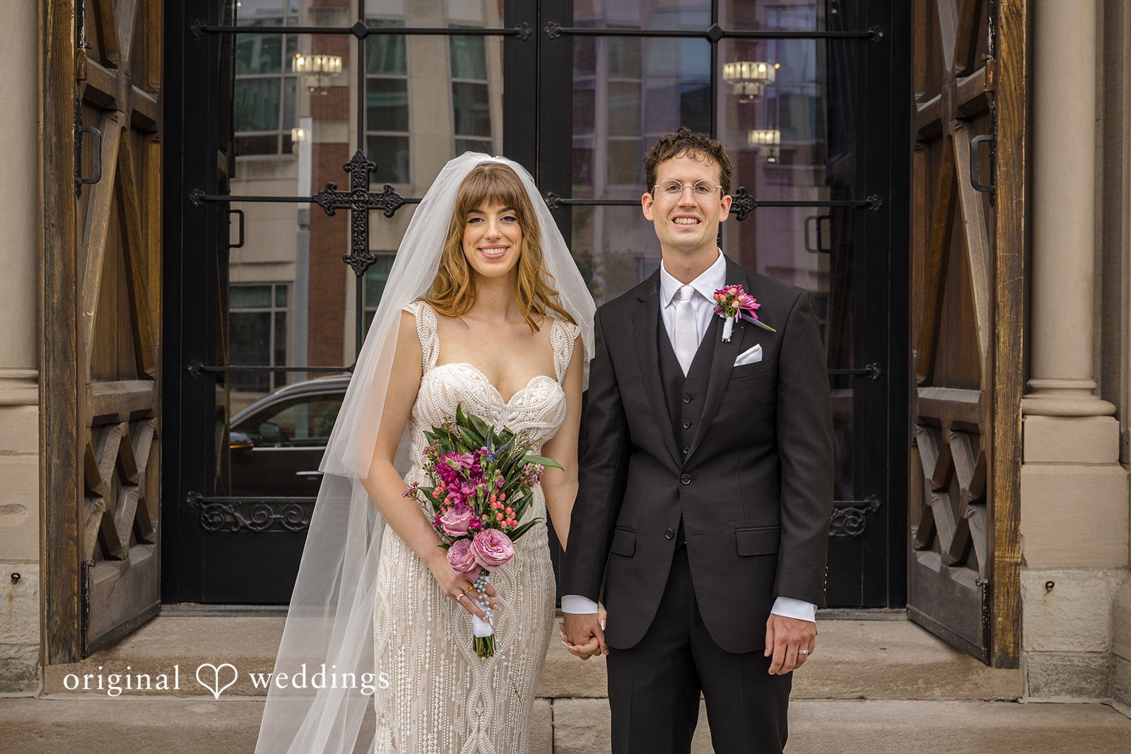 Couple standing in the church doorway, captured by Indianapolis wedding photographers from Original Weddings at St John the Evangelist Catholic Church
