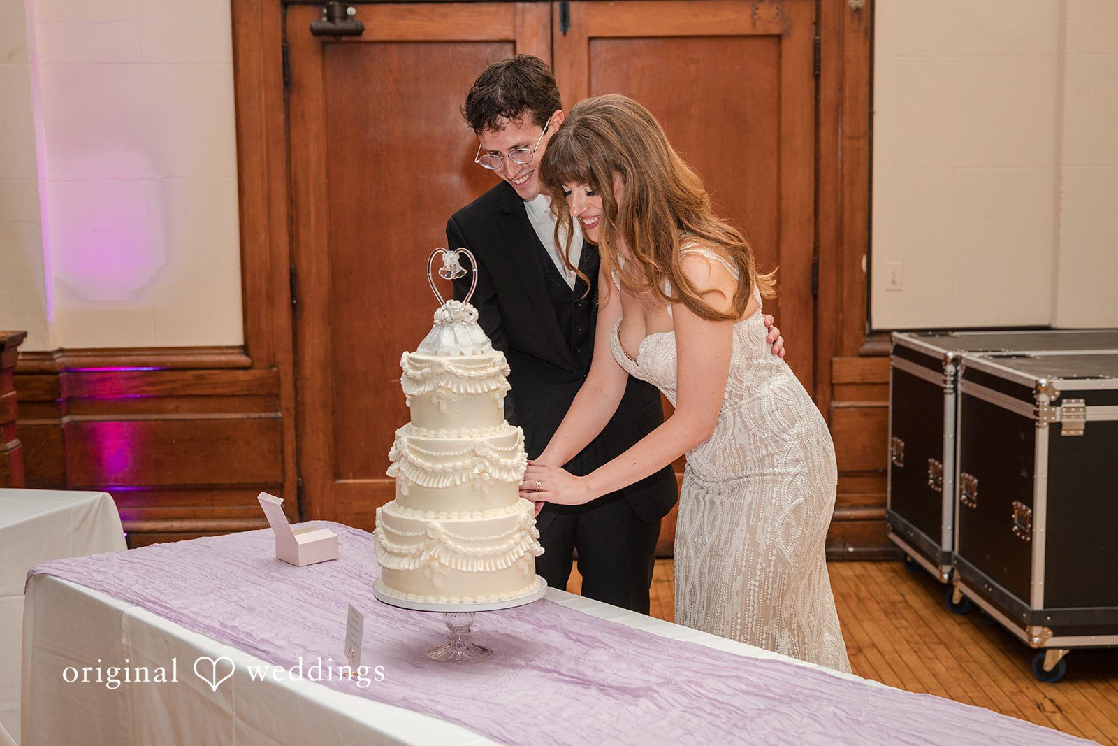 Couple cutting their wedding cake