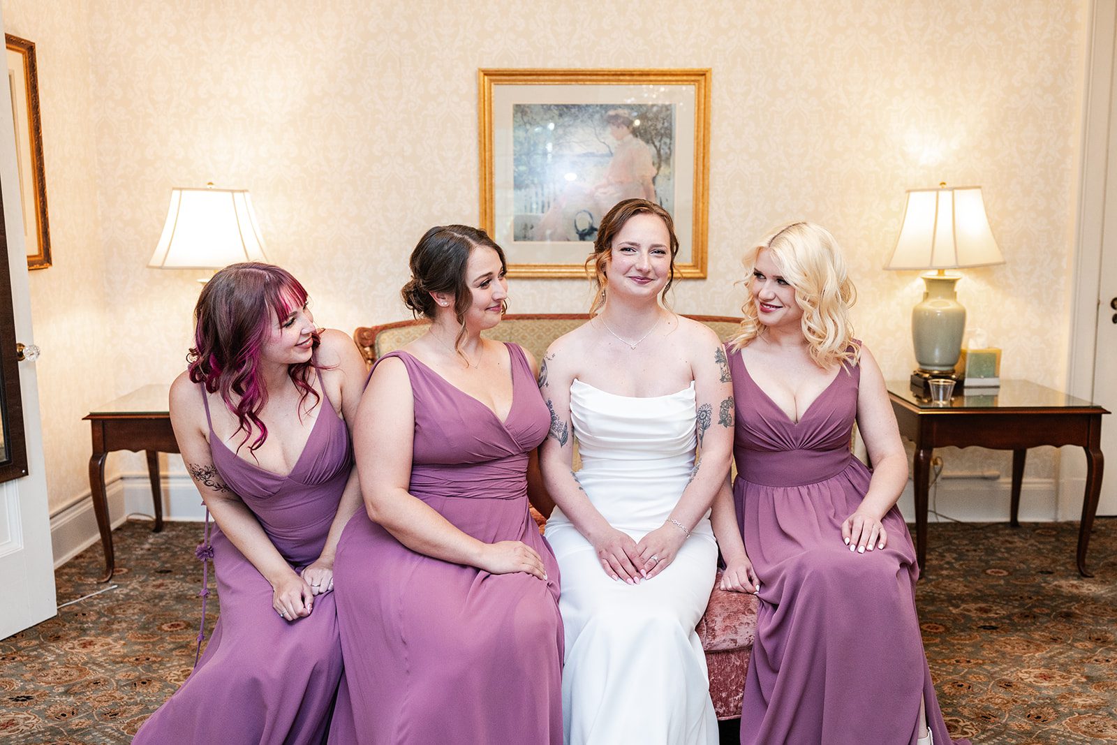 Bride with her bridesmaids in purple at St. Paul College Club Bride with her bridesmaids in purple at St. Paul College Club