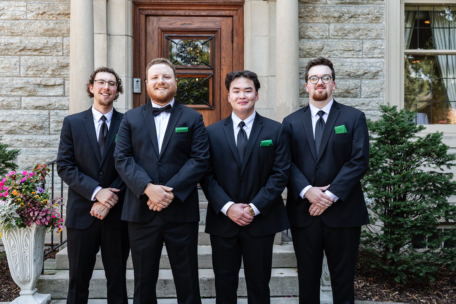 Groom with his groomsmen at the front door at St. Paul College Club Groom with his groomsmen at the front door at St. Paul College Club