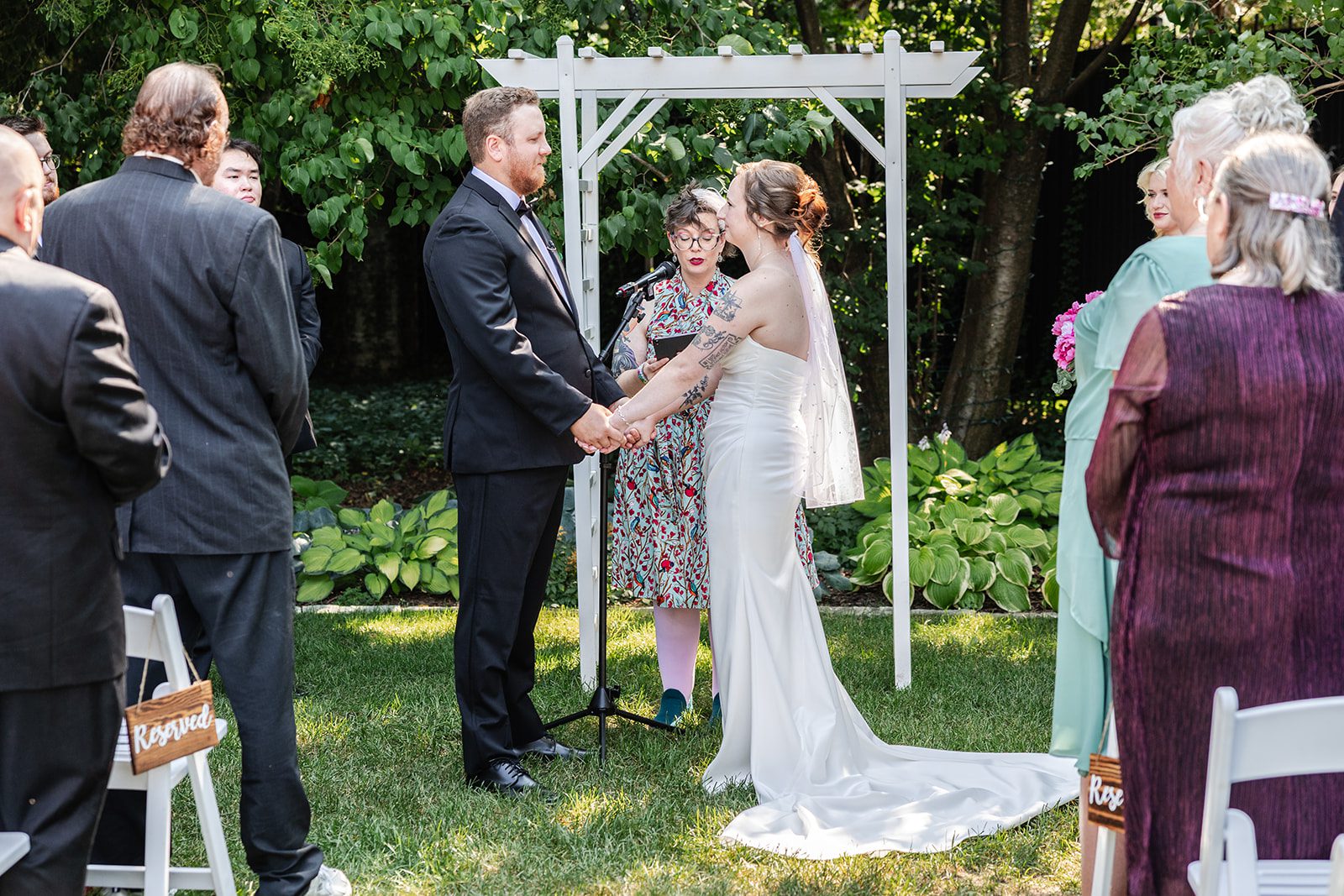 Couple sharing vows in the garden Couple sharing vows in the garden