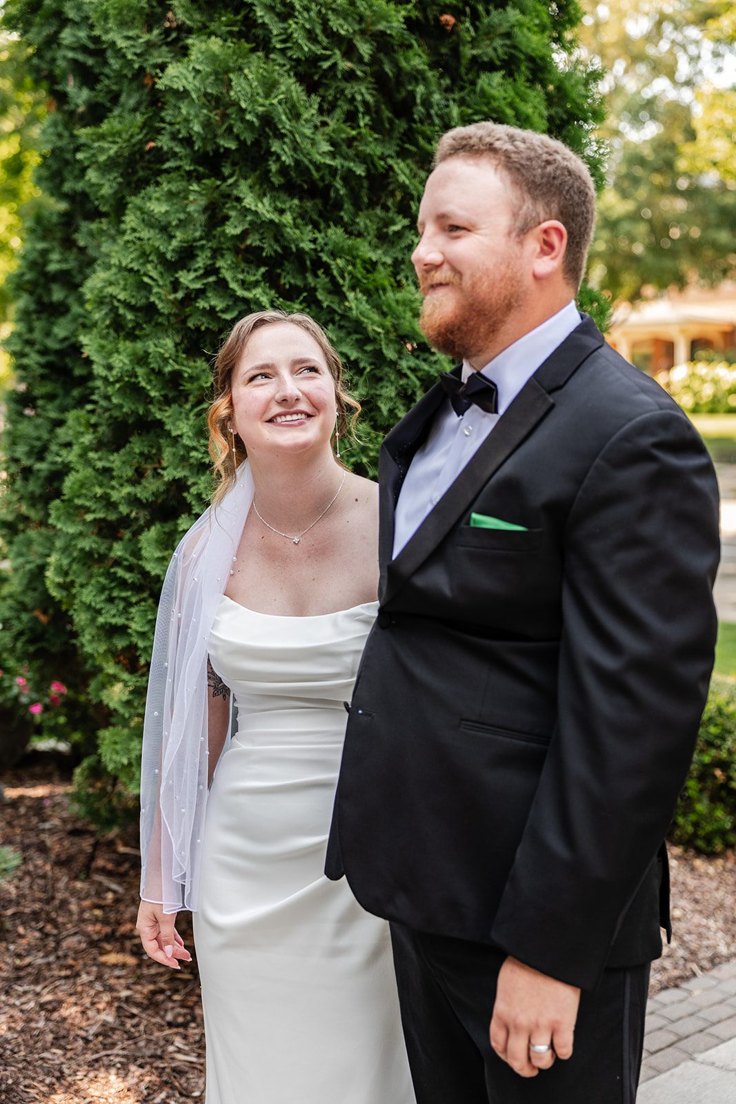 Bride and groom smiling in the garden Bride and groom smiling in the garden