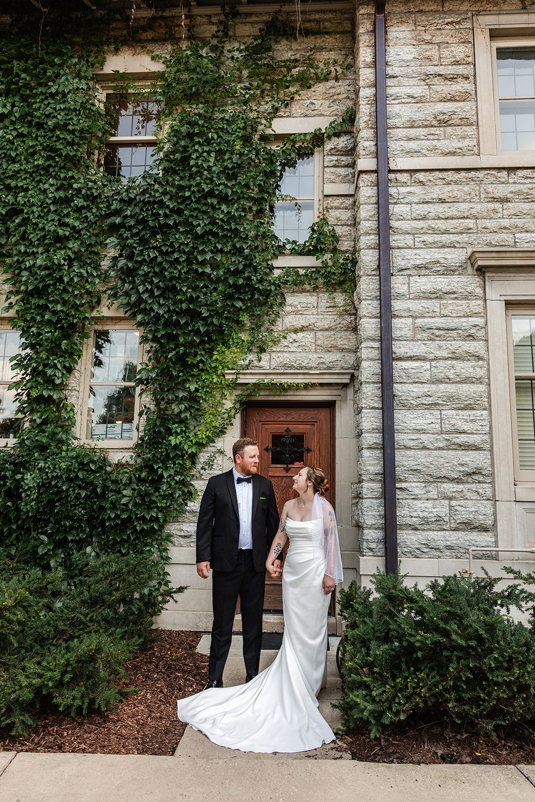 Couple by the ivy covered walls at St. Paul College Club Couple by the ivy covered walls at St. Paul College Club