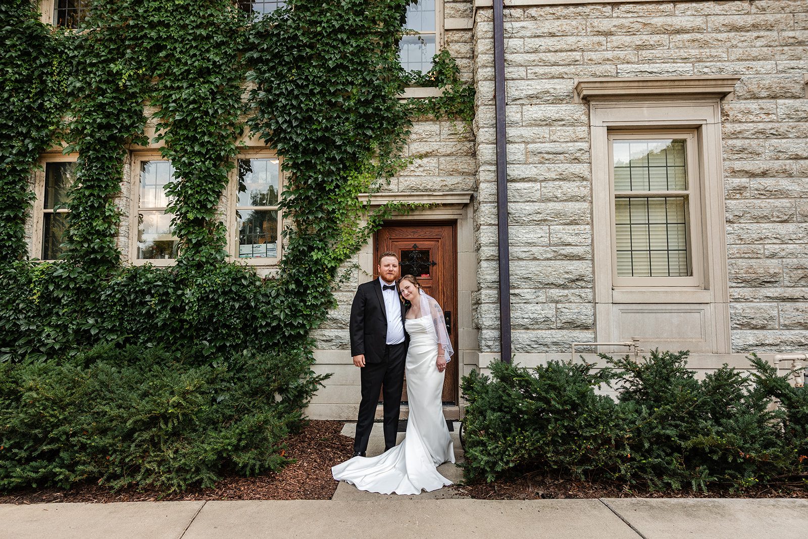 Couple beside the ivy and stone Couple beside the ivy and stone