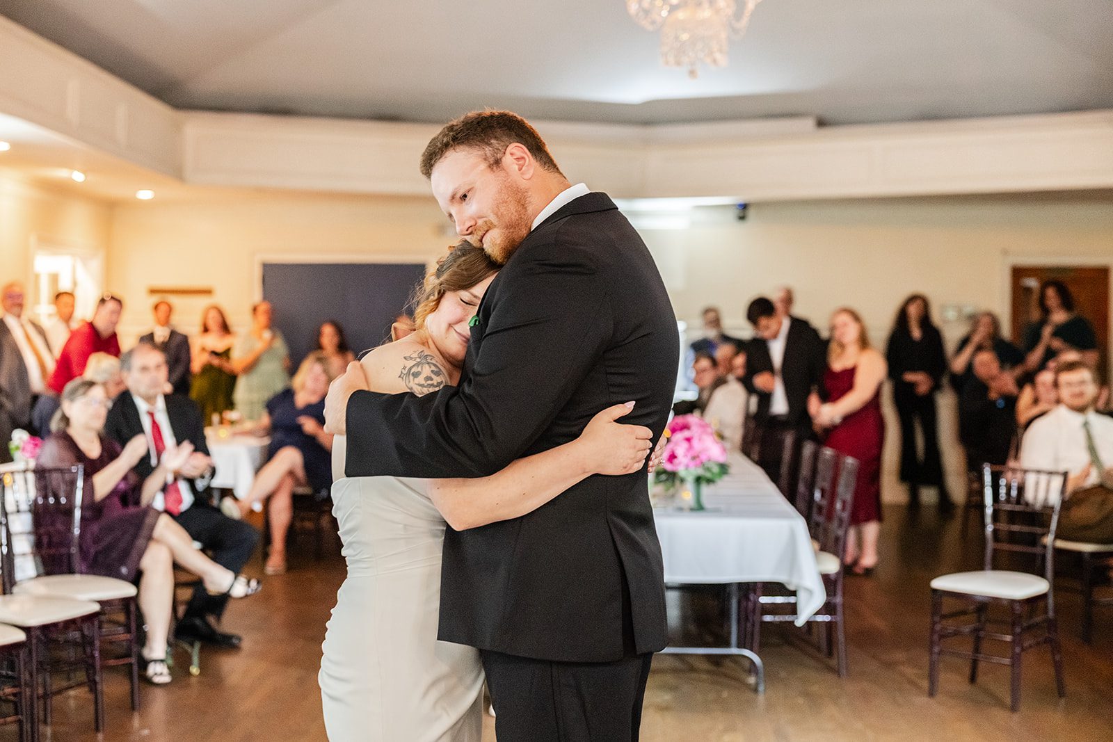 First dance with guests watching, captured by Minneapolis wedding photographers First dance with guests watching, captured by Minneapolis wedding photographers