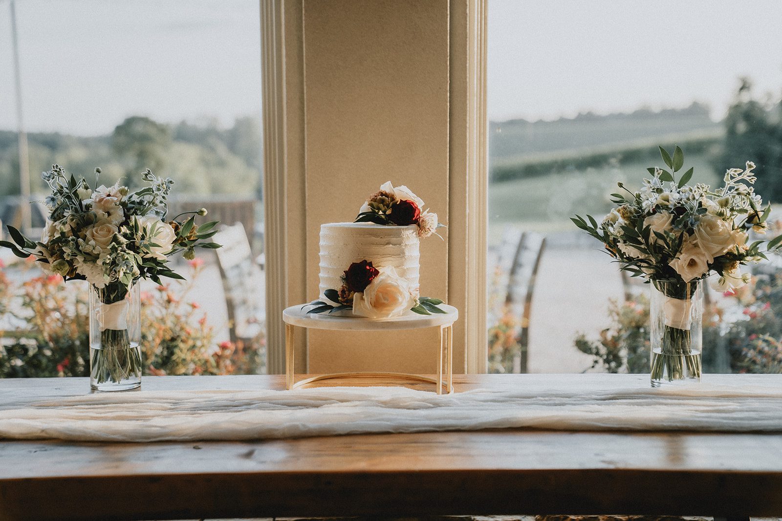 stone-tower-winery-rustic-washington-dc-nikkie-tyler-p005-13 Sweetheart table with florals and a vineyard view