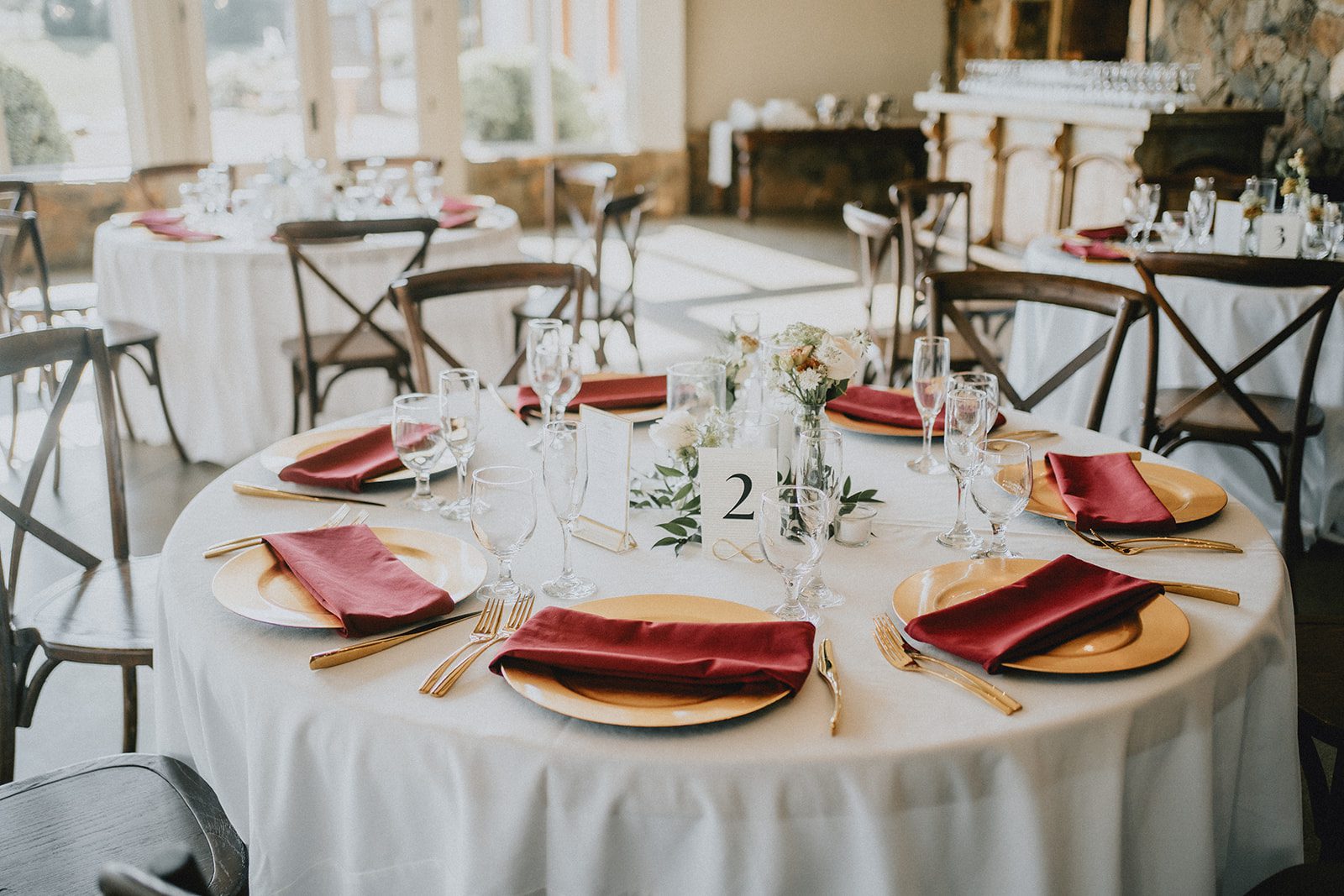 stone-tower-winery-rustic-washington-dc-nikkie-tyler-p007-04 Round reception tables set with red napkins
