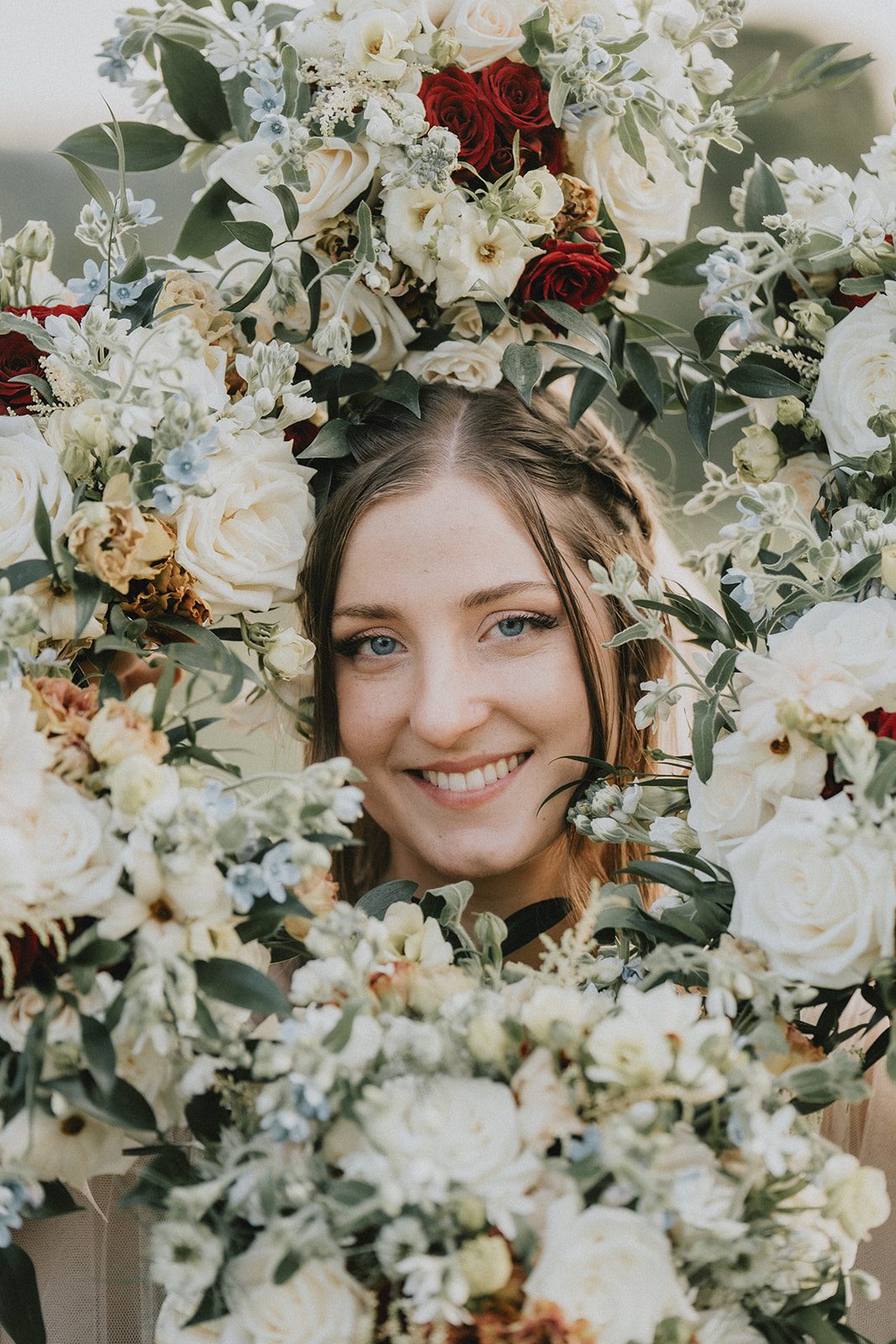 stone-tower-winery-rustic-washington-dc-nikkie-tyler-p012-19 Bride surrounded by blush and burgundy flowers