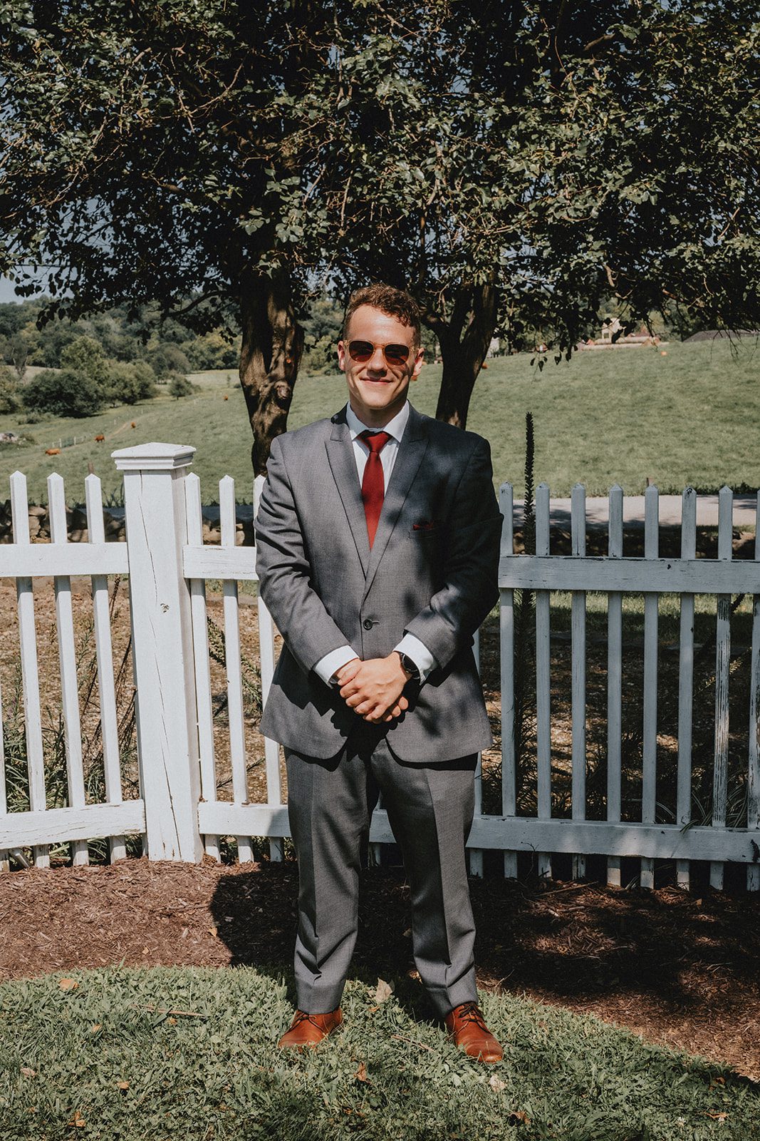stone-tower-winery-rustic-washington-dc-nikkie-tyler-p015-20 Groom waiting by the white fence