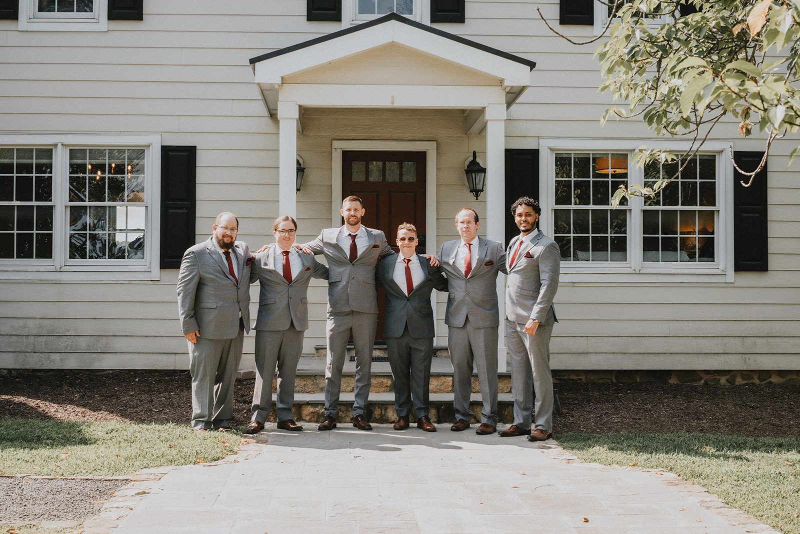 stone-tower-winery-rustic-washington-dc-nikkie-tyler-p016-02 Groom with his groomsmen in front of the house