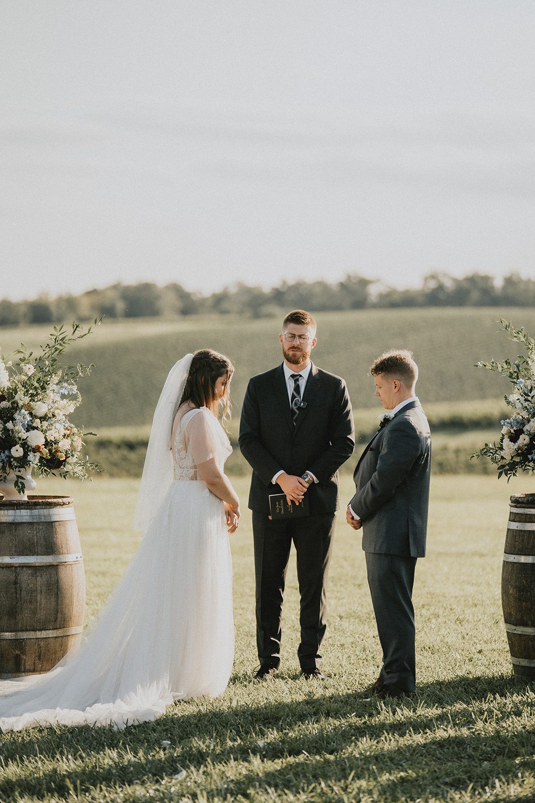 stone-tower-winery-rustic-washington-dc-nikkie-tyler-p022-01 Couple standing with the officiant