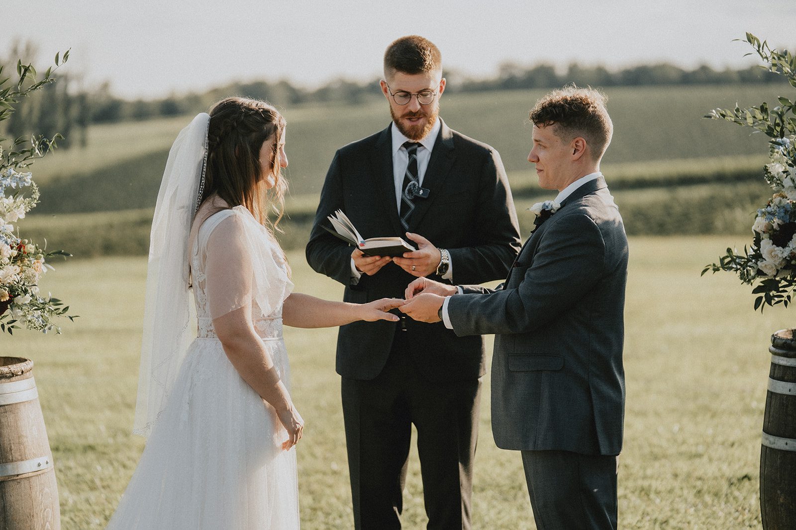 stone-tower-winery-rustic-washington-dc-nikkie-tyler-p023-06 Exchanging rings at the outdoor ceremony