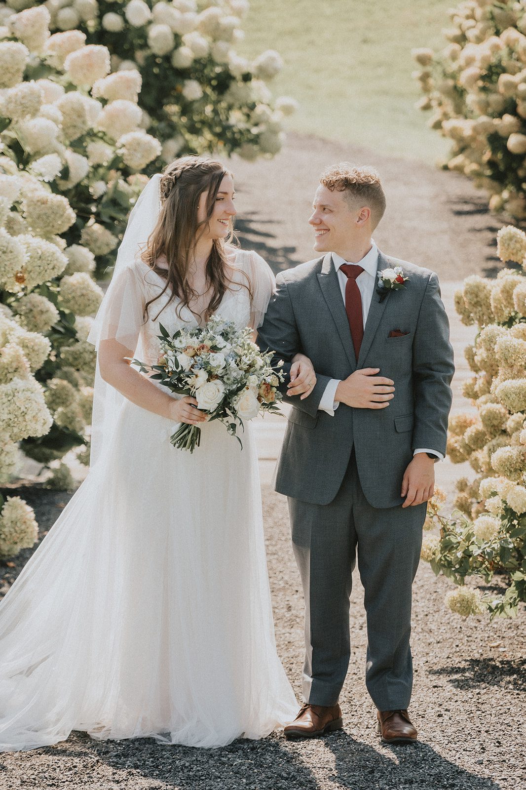 stone-tower-winery-rustic-washington-dc-nikkie-tyler-p034-03 Bride and groom among the hydrangeas