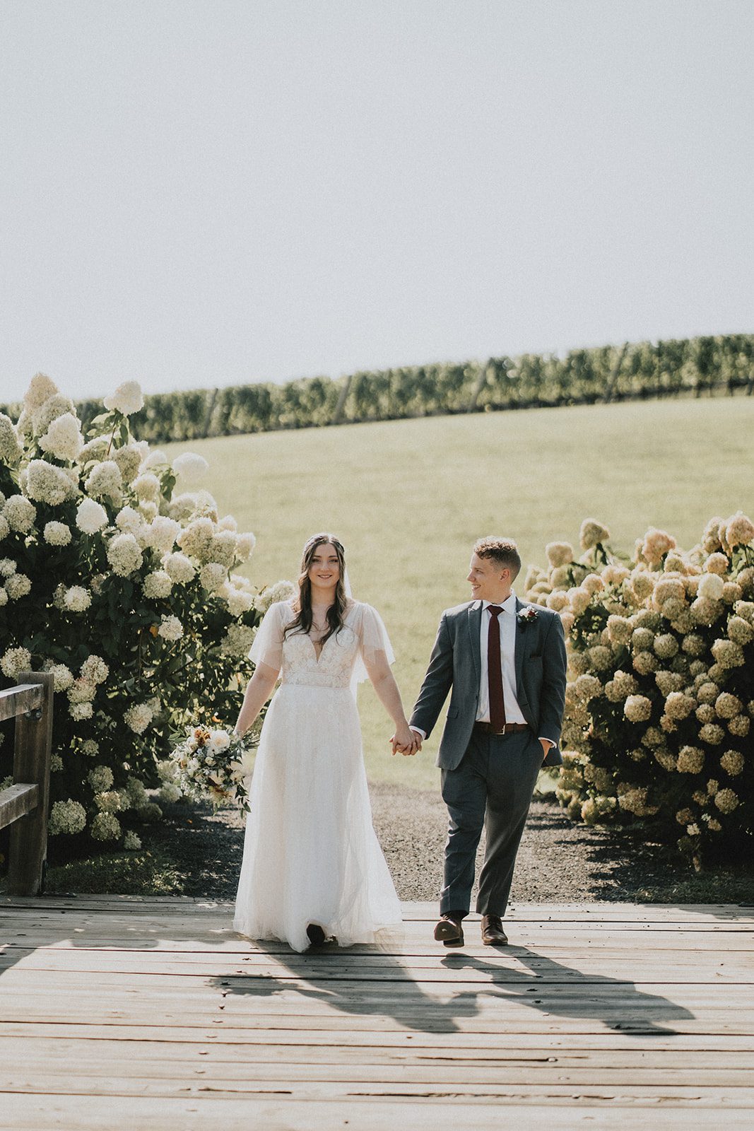 stone-tower-winery-rustic-washington-dc-nikkie-tyler-p036-10 Bride and groom walking on the path