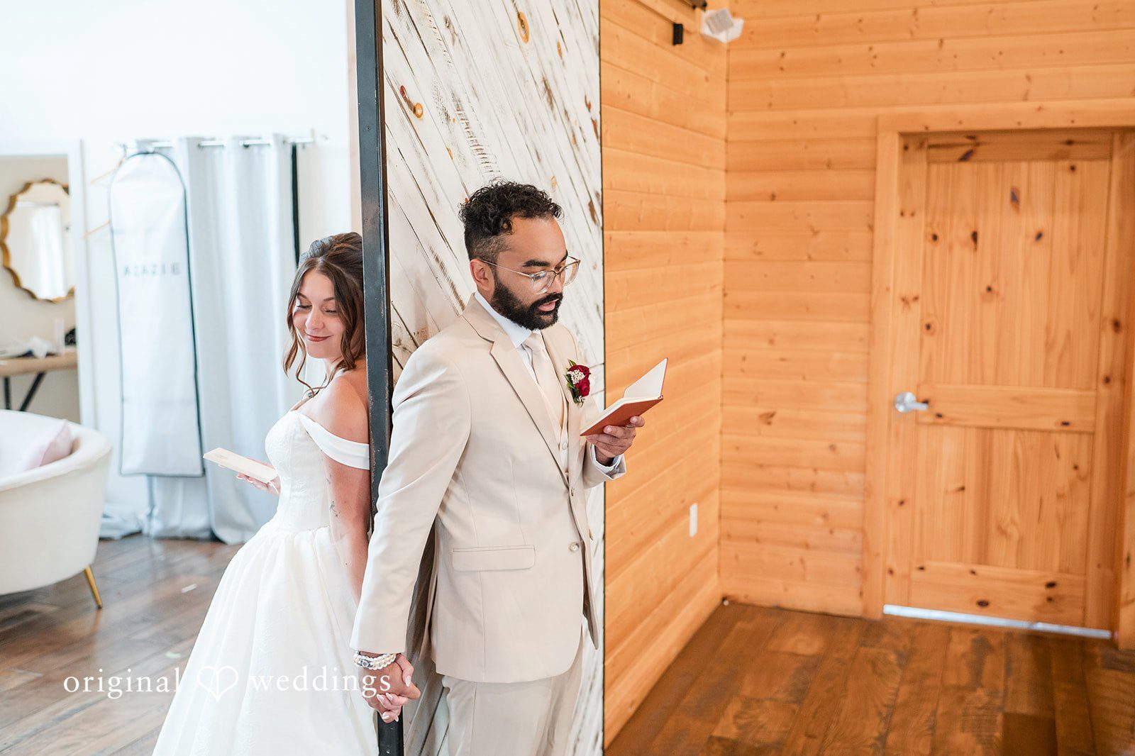 Our Cincinnati wedding photographers at Original Weddings captured the couple reading their vows at the Stone Valley Meadows lodge