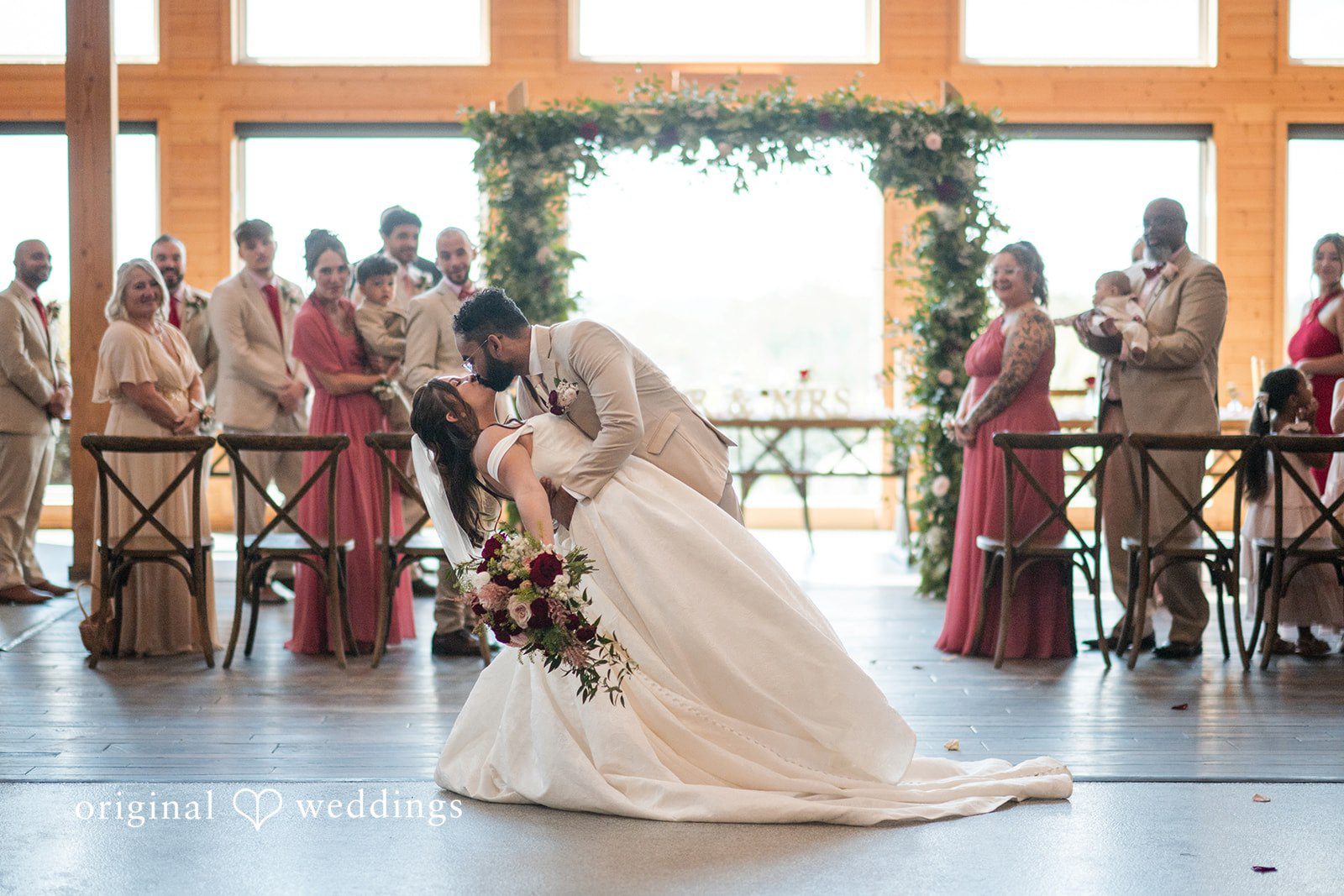 A romantic portrait of the couple on the aisle