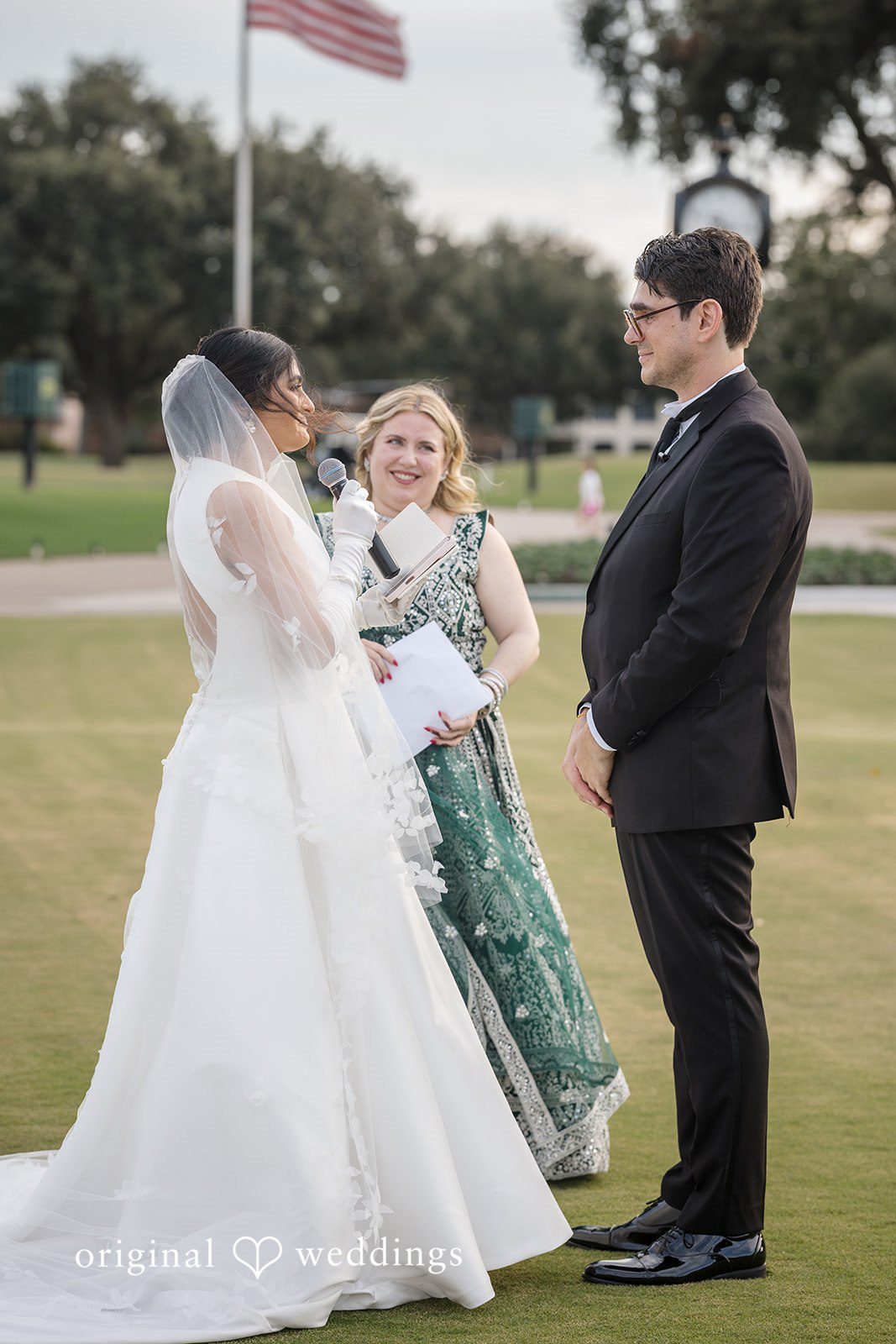 Nicholas + Nisha Bride walking toward the groom during their wedding ceremony.
