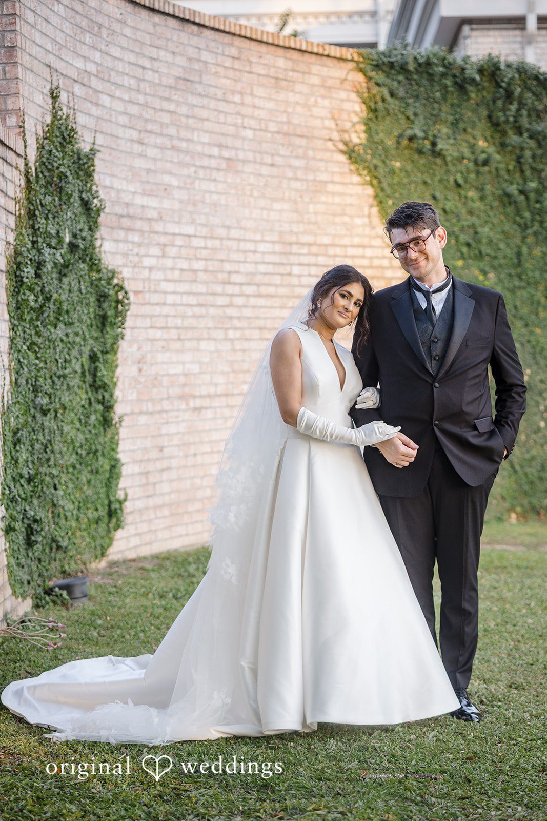 Nicholas + Nisha Bride and groom walking down a set of stone steps together.