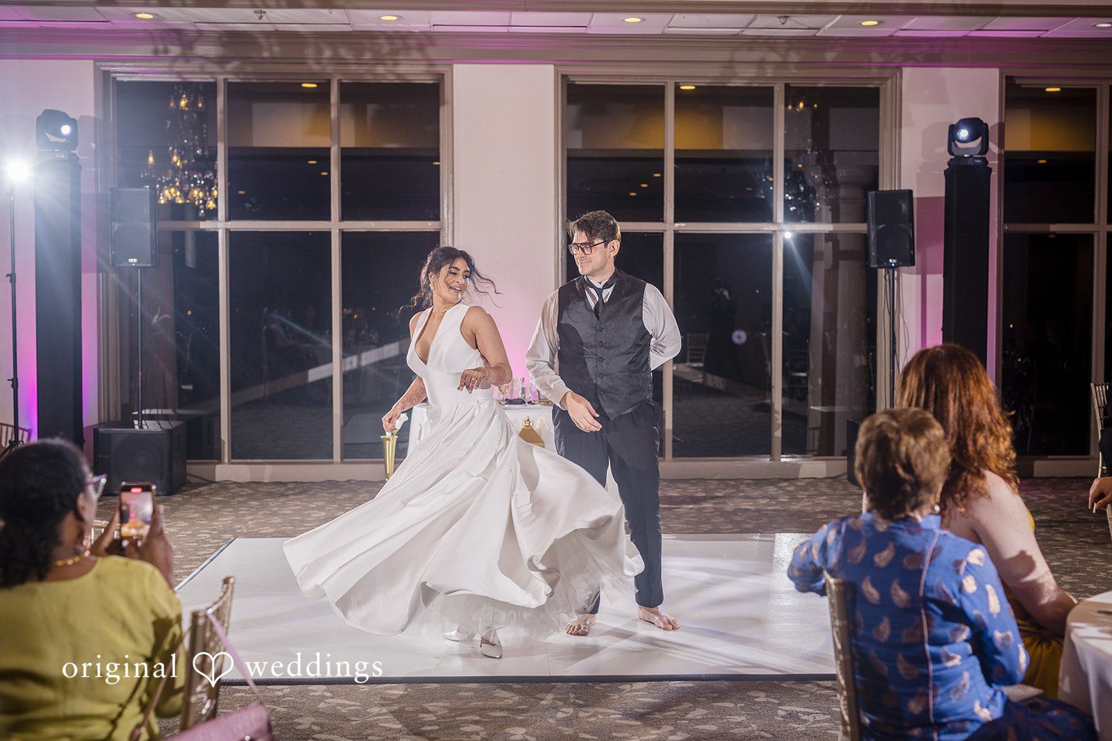 Nicholas + Nisha Bride and groom dancing together at their reception.