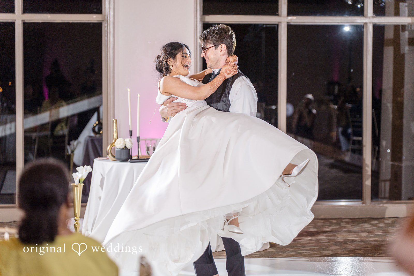 Nicholas + Nisha Bride being lifted in the air during a lively reception dance.