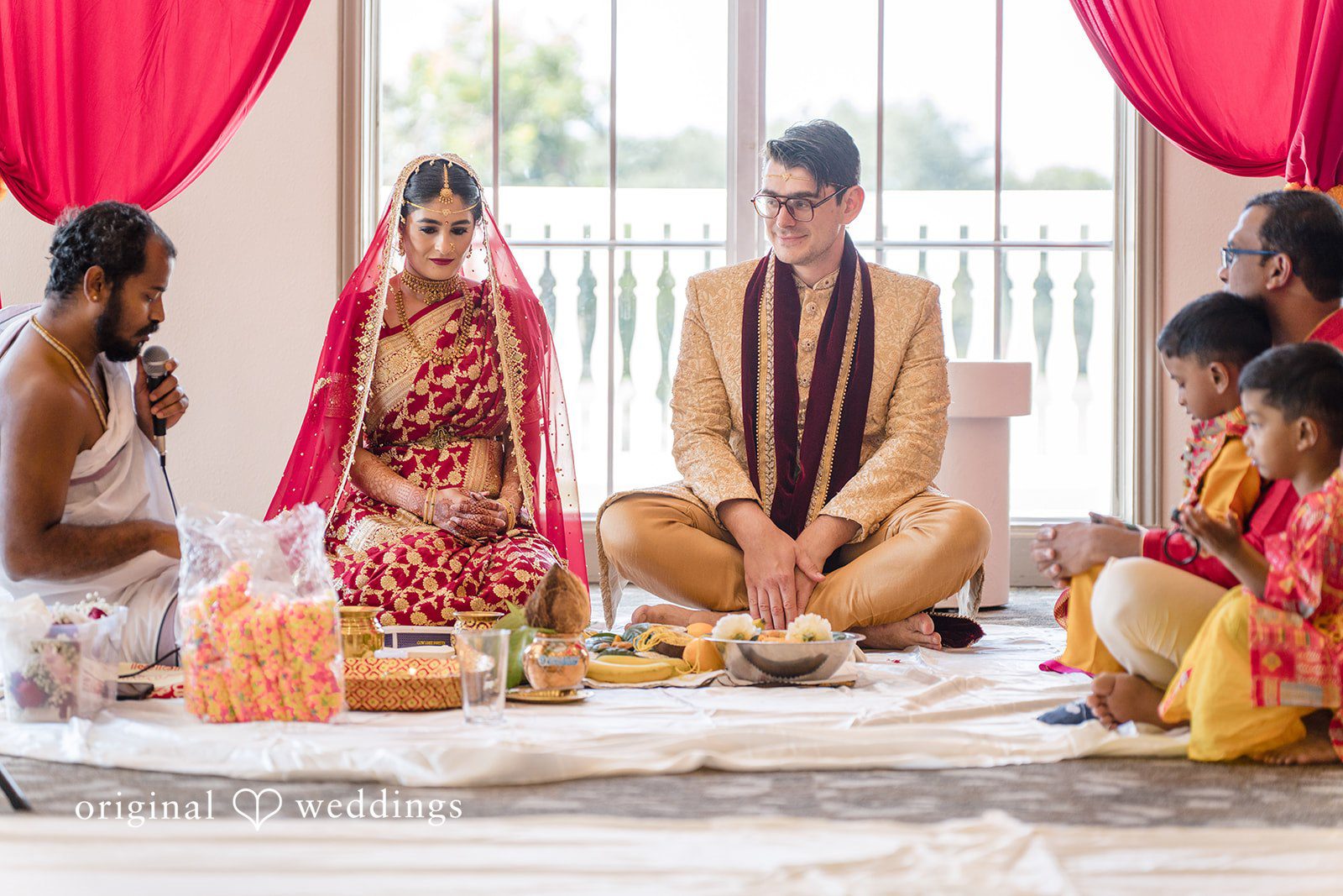 Nicholas + Nisha Wedding guests gathered around a central ceremonial setup.