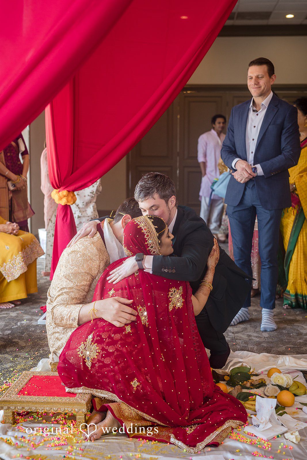 Nicholas + Nisha Guests gathered around the bride and groom during a wedding celebration.