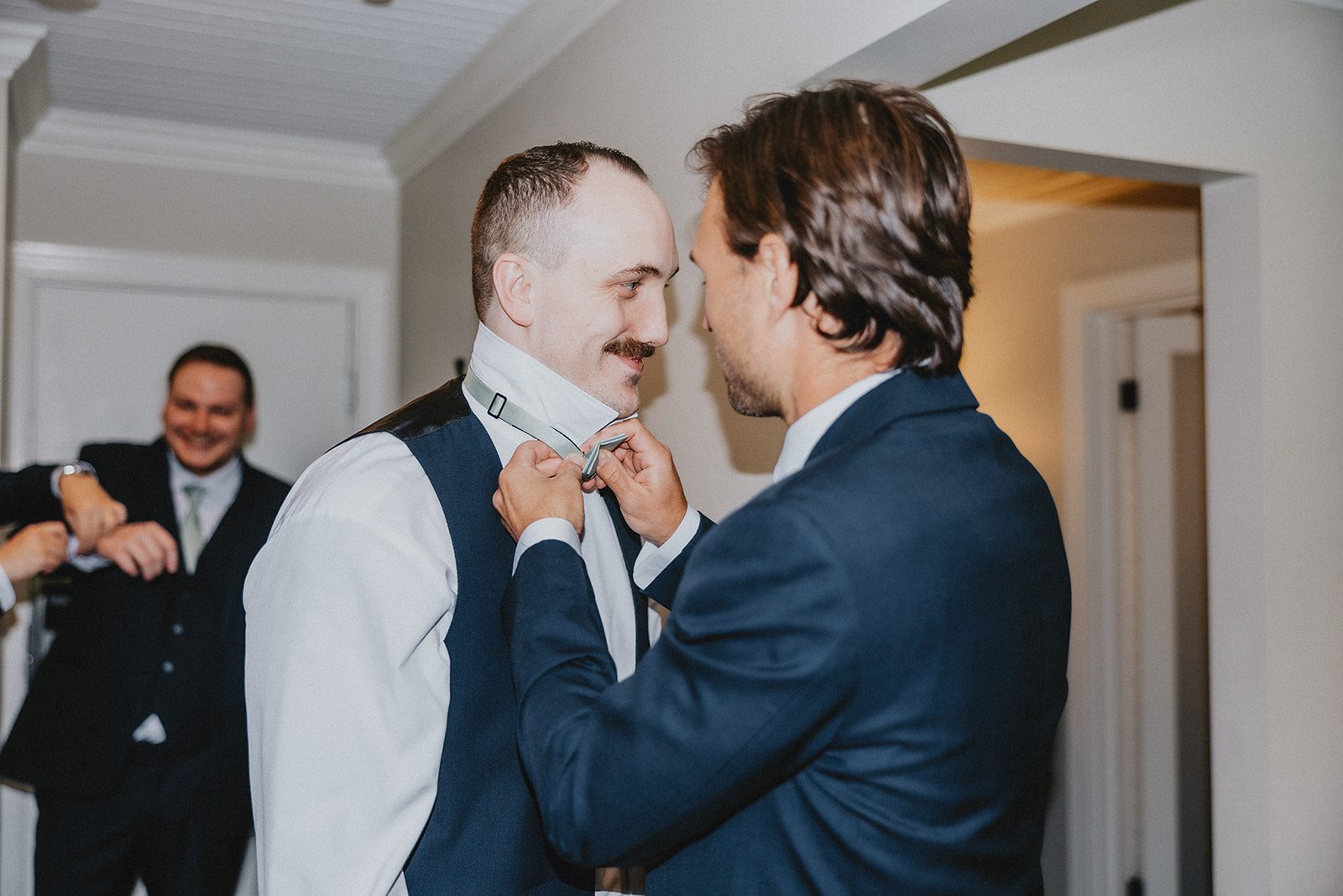 sun-valley-rustic-cleveland-jamie-nick-015-12 Groom getting help with his tie