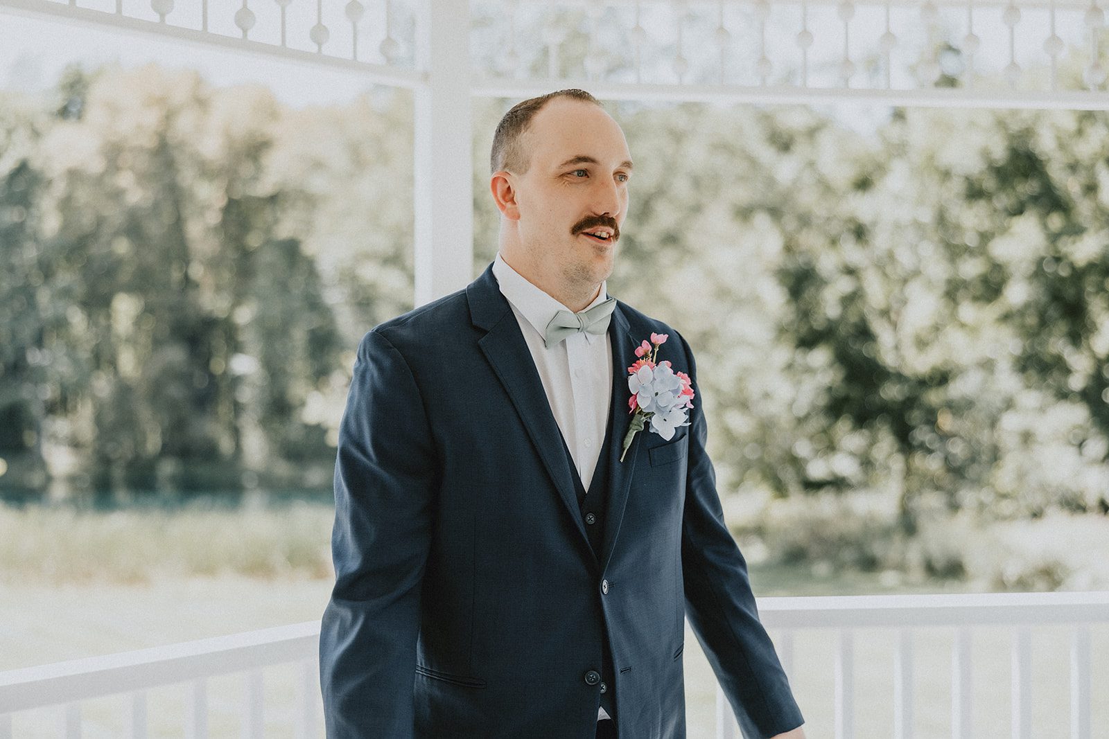 sun-valley-rustic-cleveland-jamie-nick-030-16 Groom smiling before the first look