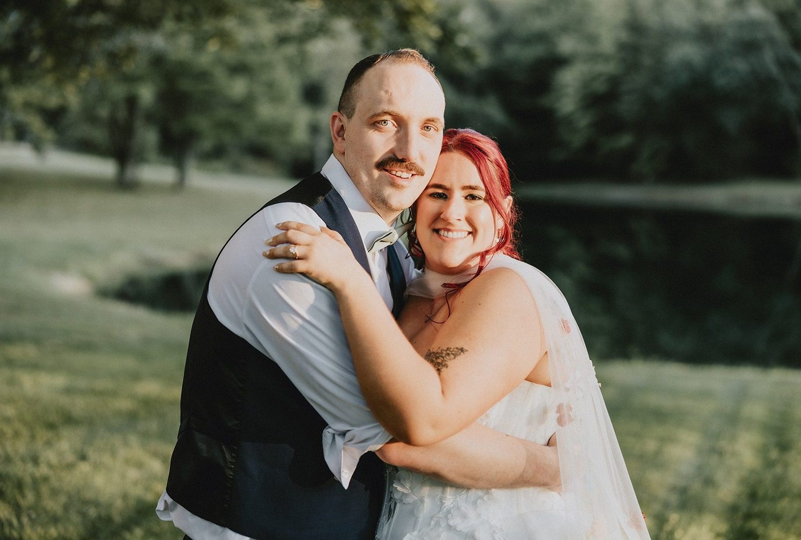 Bride and groom embracing in the evening light, captured by Cleveland wedding photographers from Original Weddings at Sun Valley