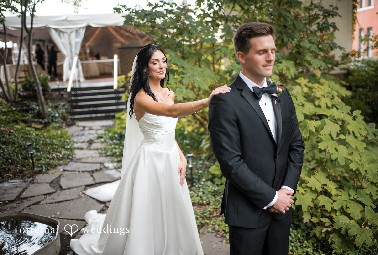 Bride and groom standing together in the garden, captured by Cincinnati wedding photographers from Original Weddings at Taft Museum of Art