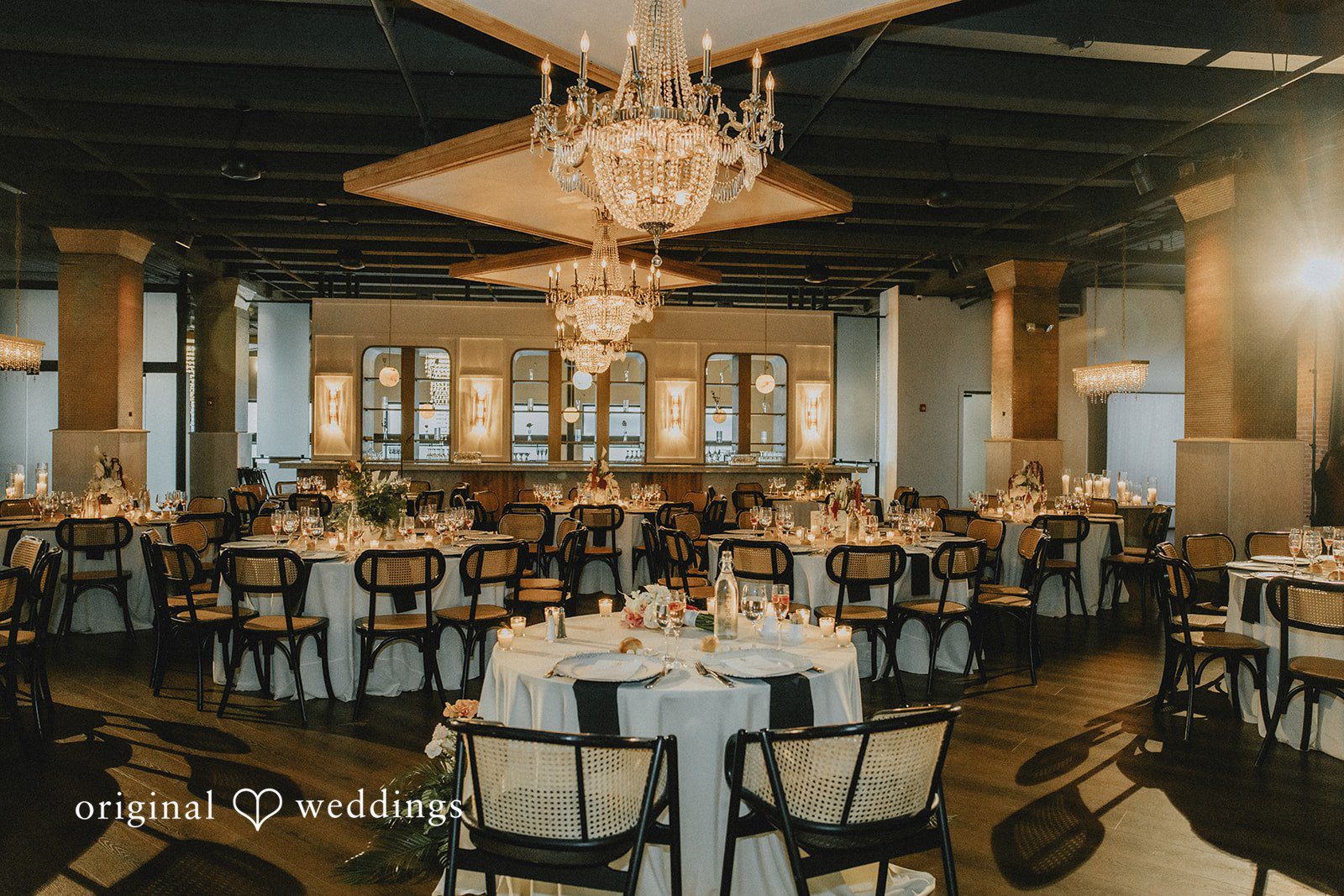 Sasha + Jason Decorated tables in the wedding reception hall