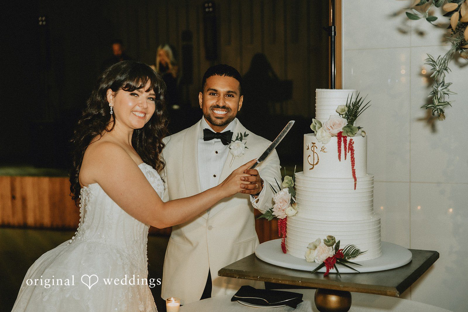 Sasha + Jason The couple cuts their wedding cake