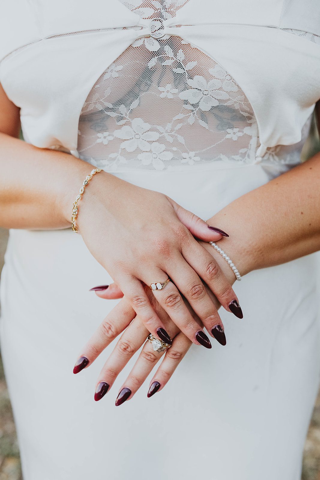 texas-backyard-rustic-austin-megan-kyle-p021-12 Bride's hands and ring on her gown