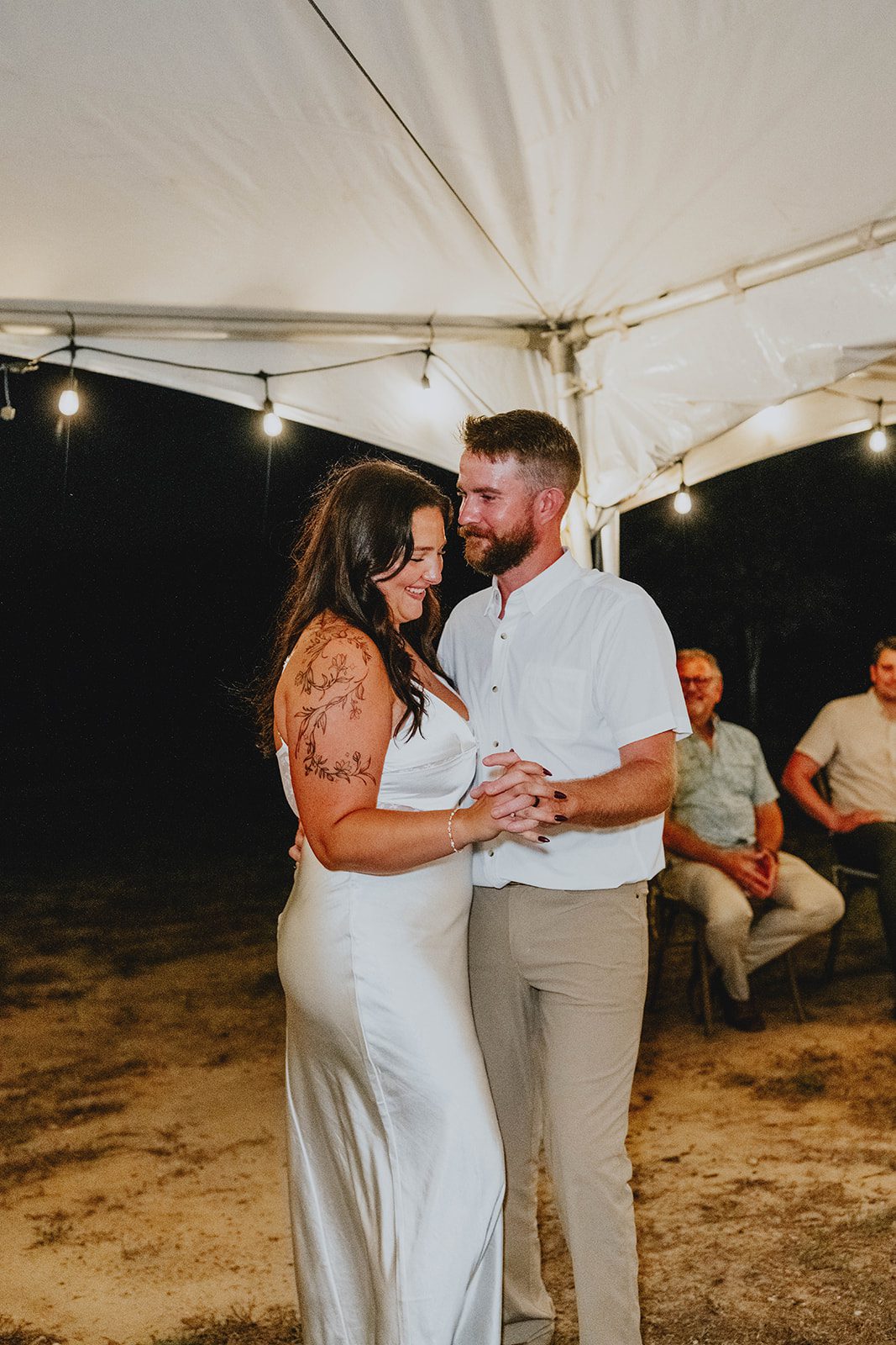 texas-backyard-rustic-austin-megan-kyle-p024-05 First dance under the tent lights