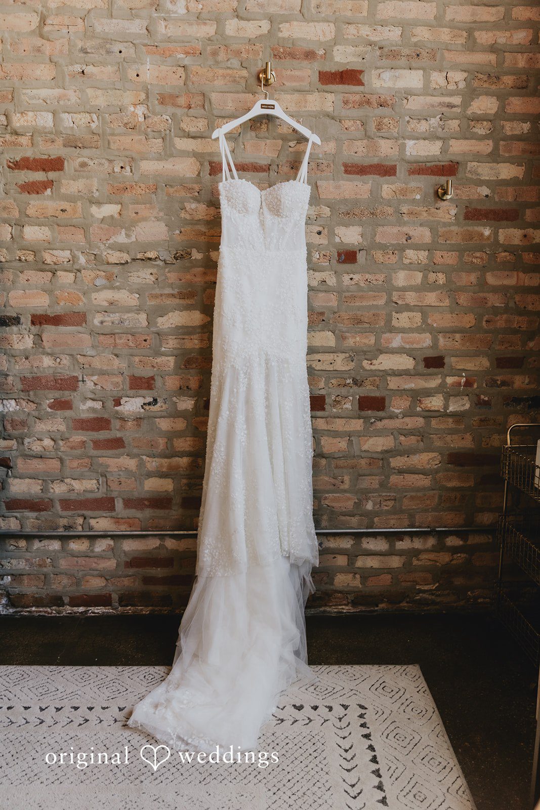 The bride's gown hangs gracefully