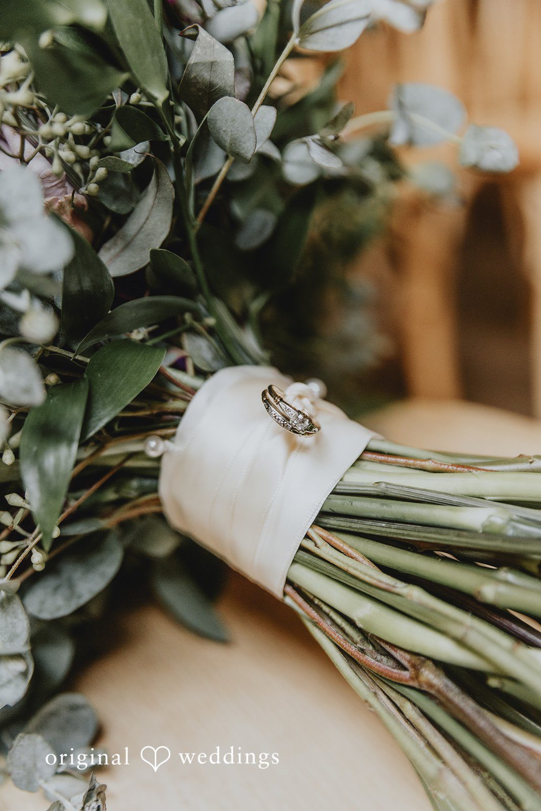 Detail shot of the wedding bouquet and ring