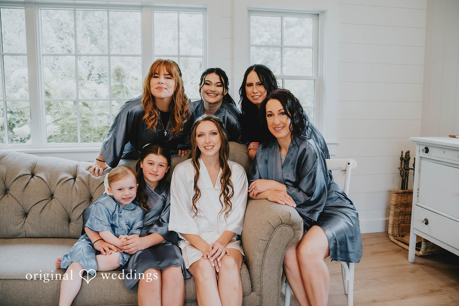Bride with her bridesmaids getting ready