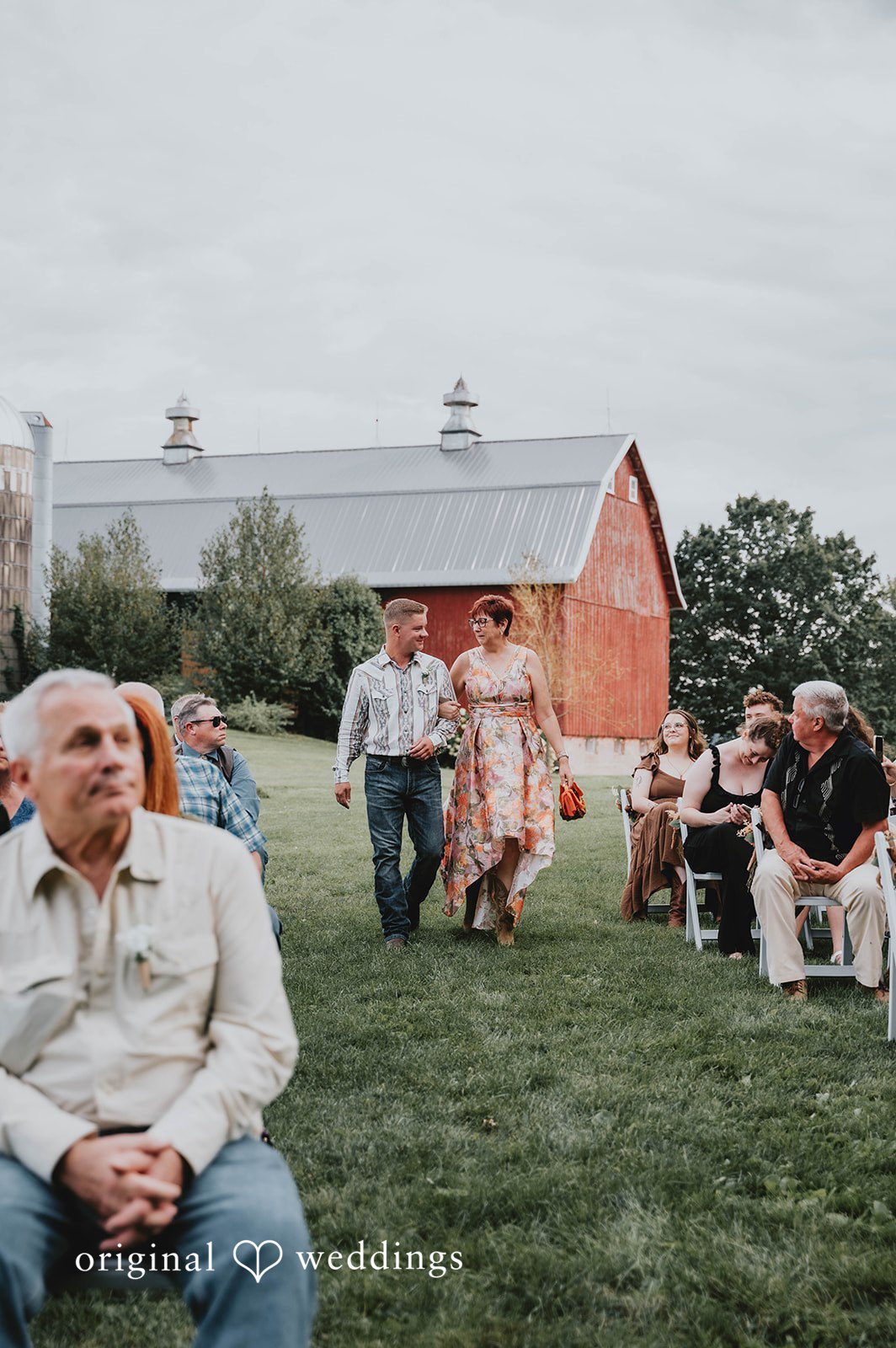 Guests gathered by the red barn