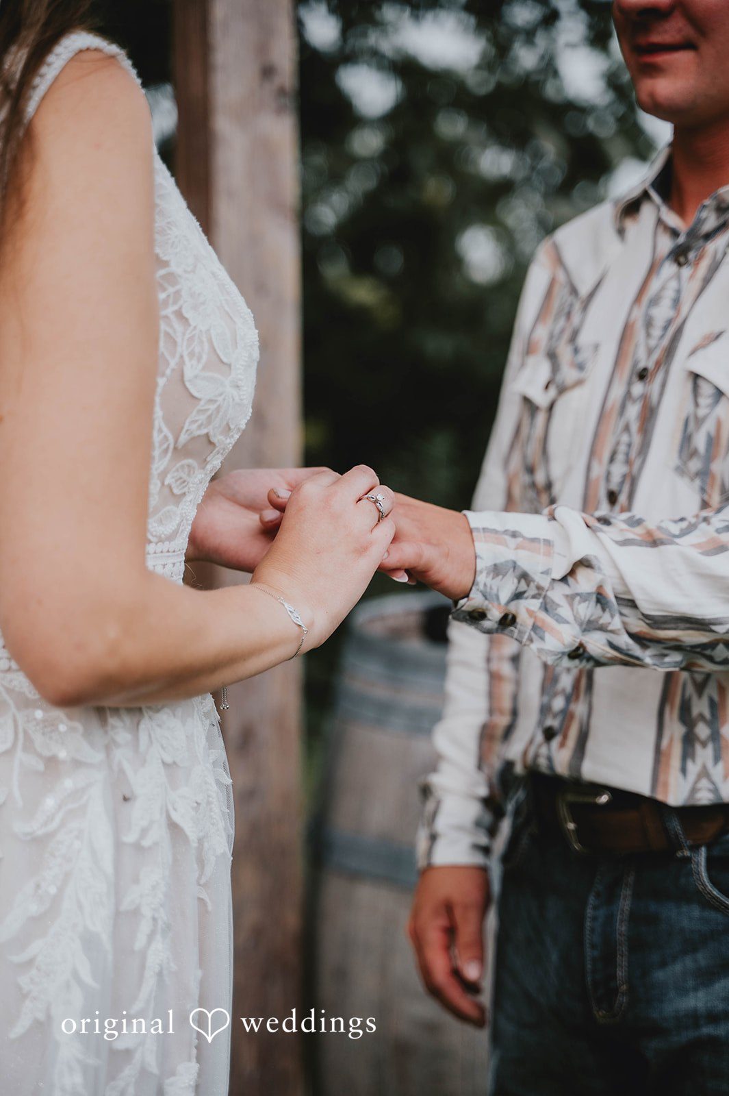 Couple holding hands during the vows