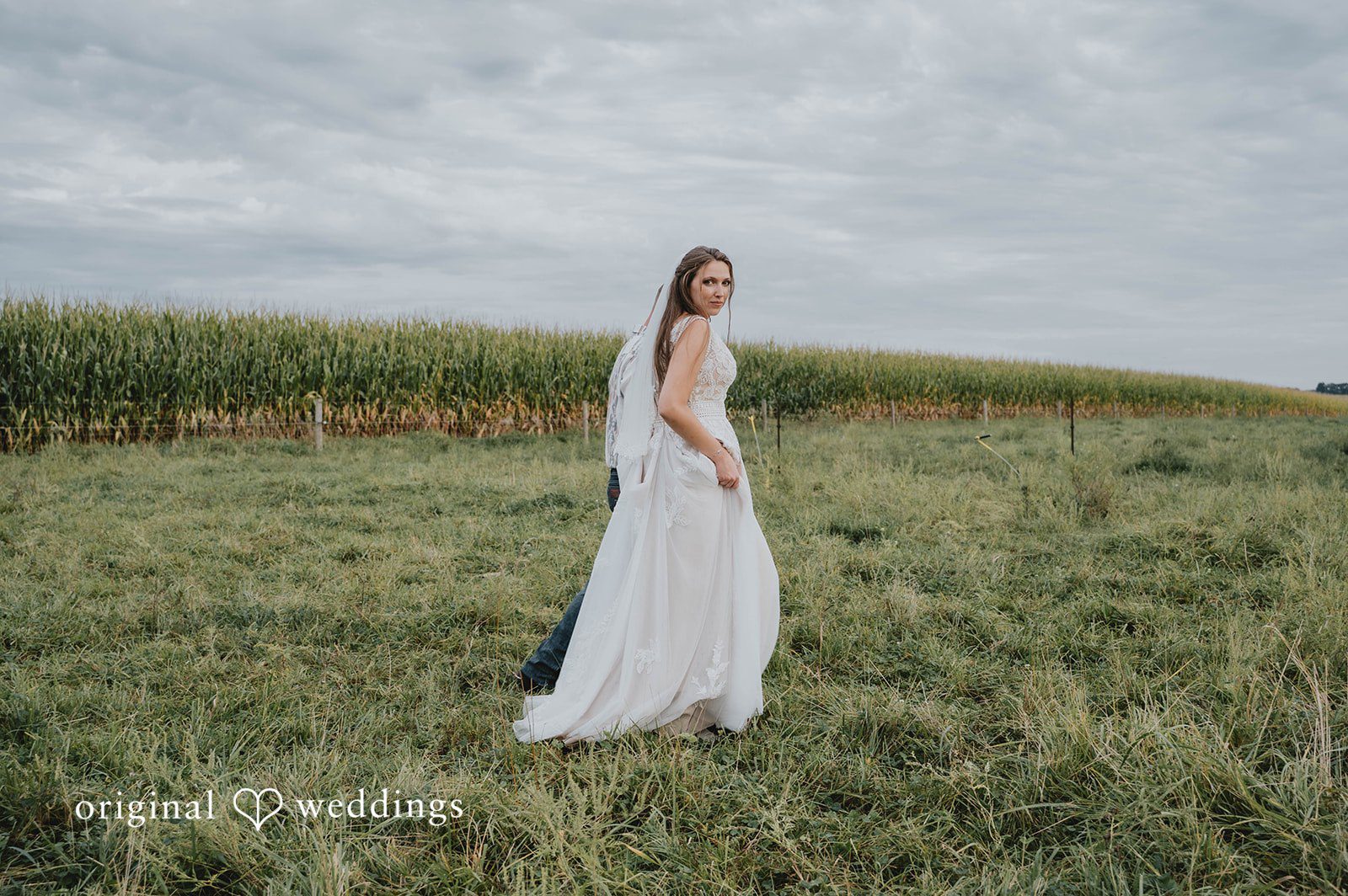 Bride standing in the field