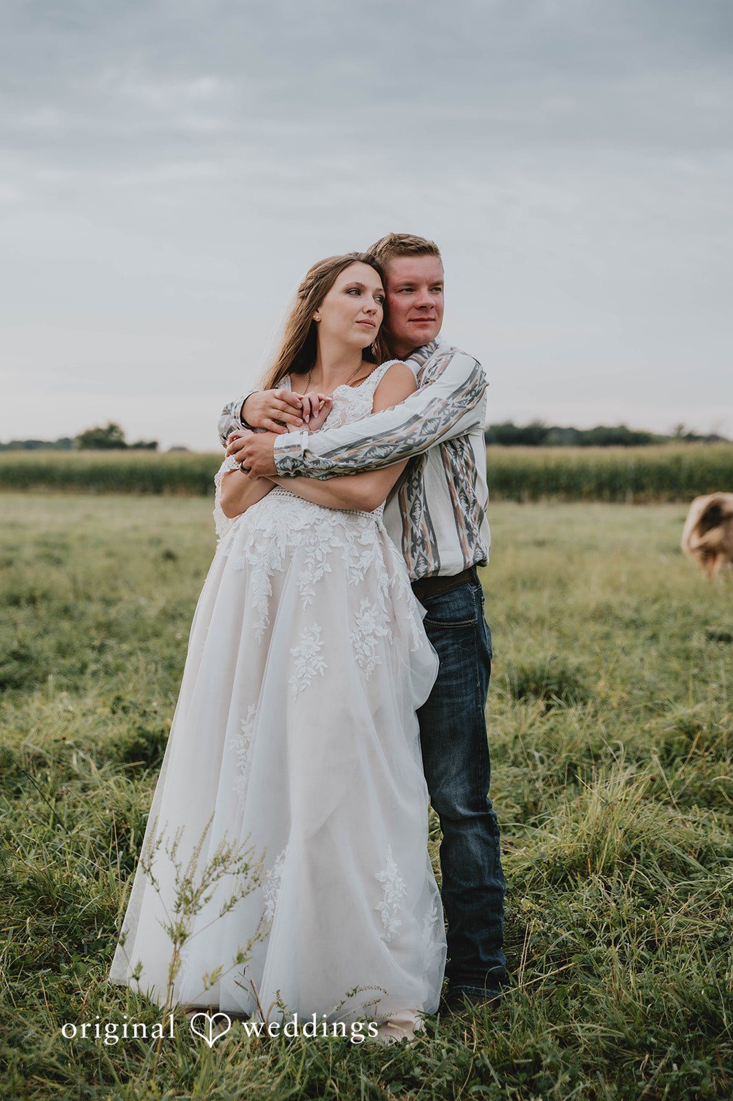 Couple embracing in the field