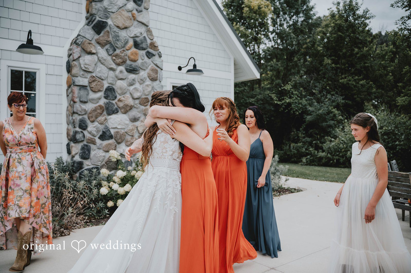 Bride hugging her bridesmaids