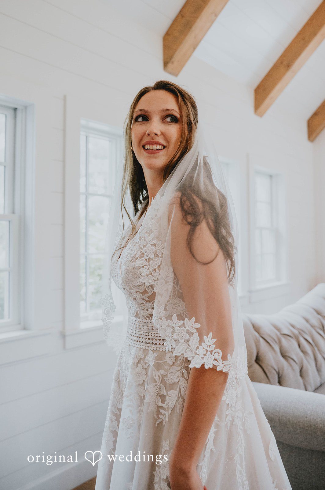 Bride smiling in her veil at The Barn at Ballard Creek