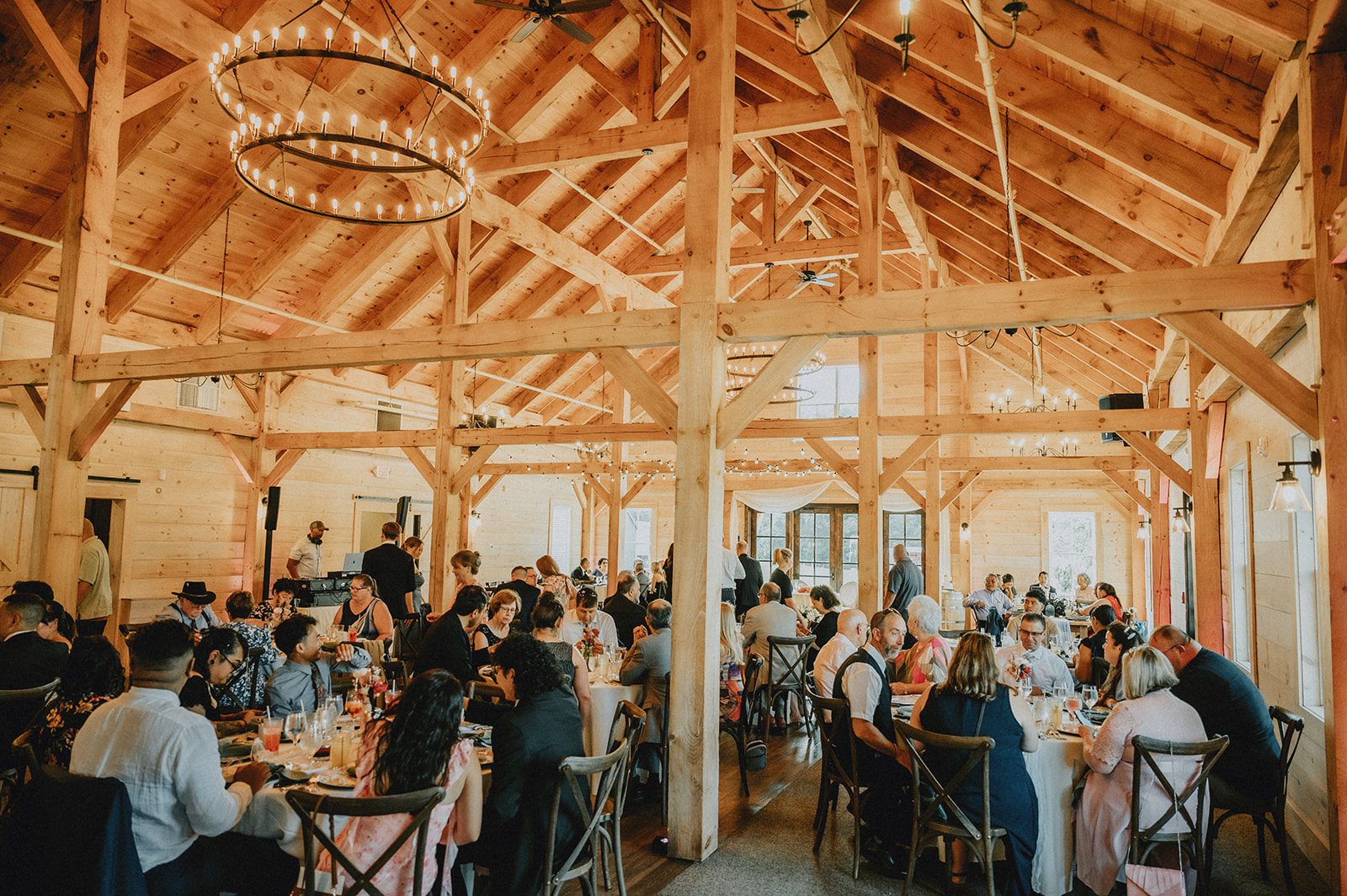 Barn reception hall with wood beams at The Barn at Blackstone National Barn reception hall with wood beams at The Barn at Blackstone National